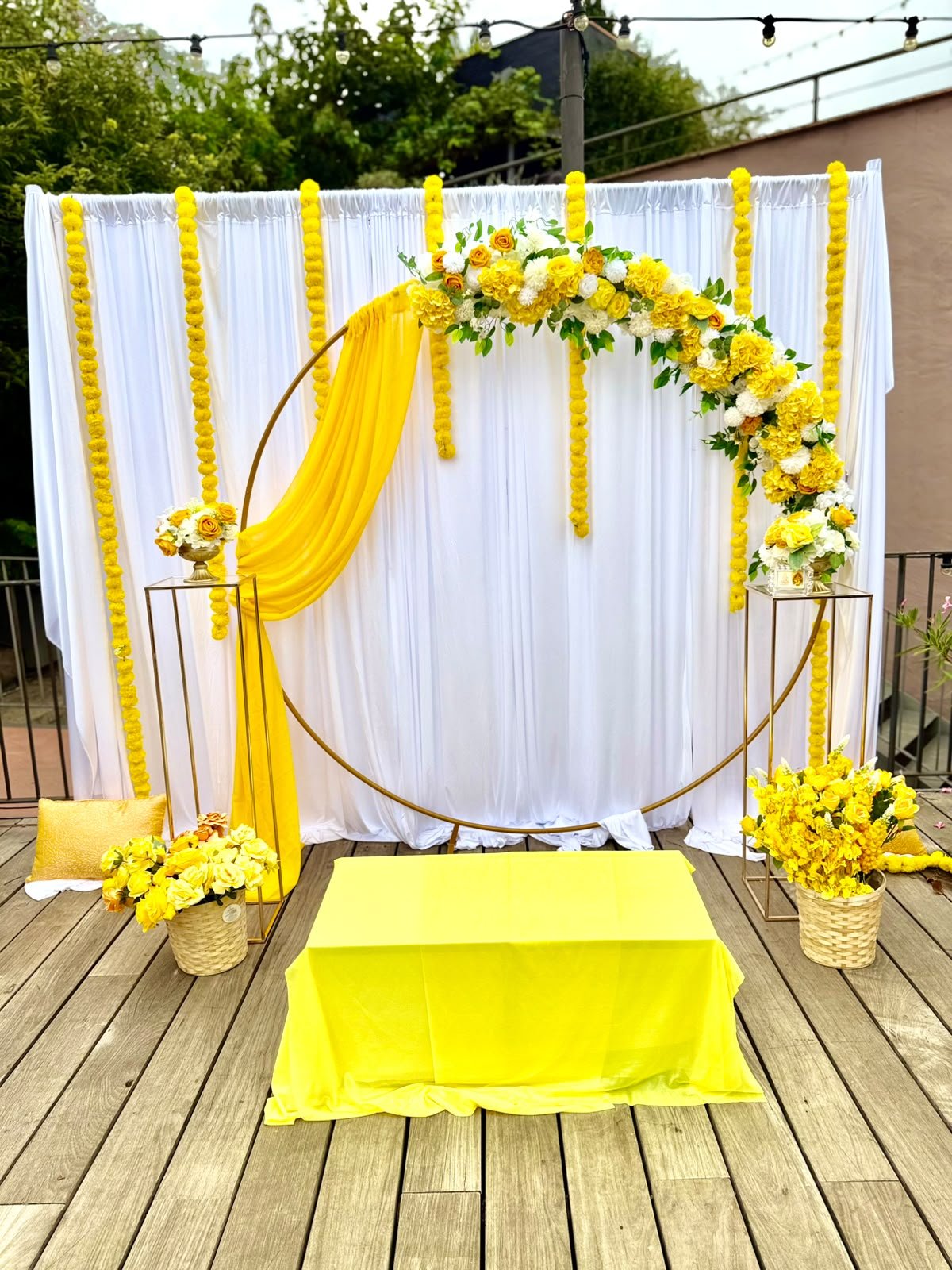 Sha Celebrations golden floral hoop backdrop for an Indian celebration in Catalunya